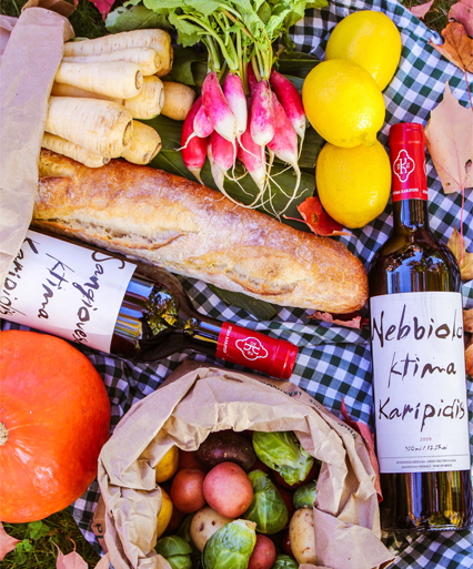 wine with food on a picnic blanket