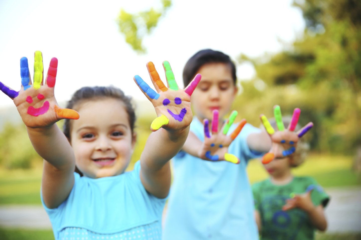 Children with paint on hands